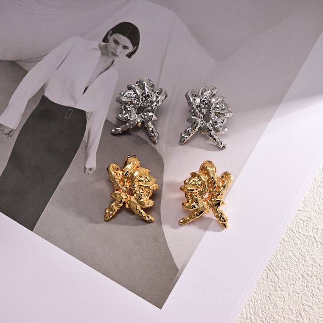 Loewe's new letter stud earrings feature a unique and versatile design. They'll