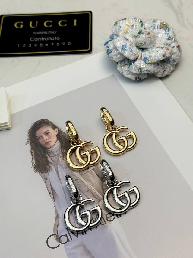 New Gucci Double G Metal Earrings These Gucci double G metal earrings feature th
