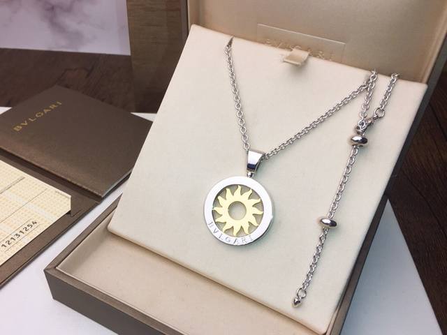 Bulgari Classic Rotating Sun Necklace, a mid-length chain necklace suitable for