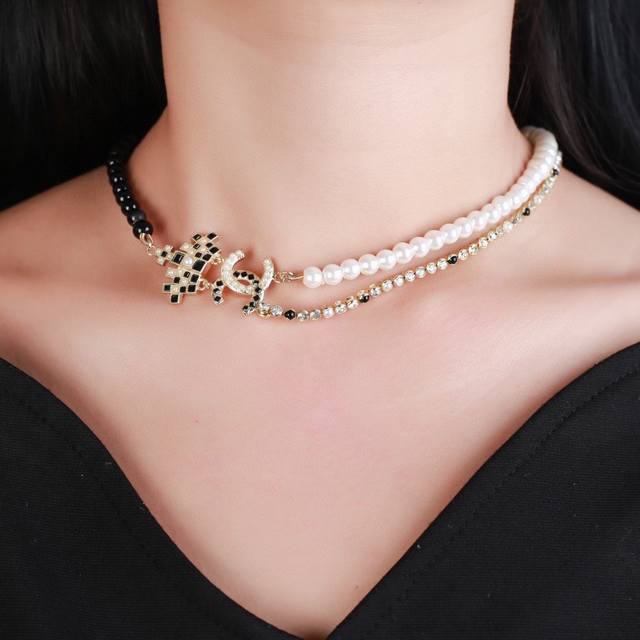 Chanel's new necklace, a pearl crown necklace, is now available in boutiques. Ex