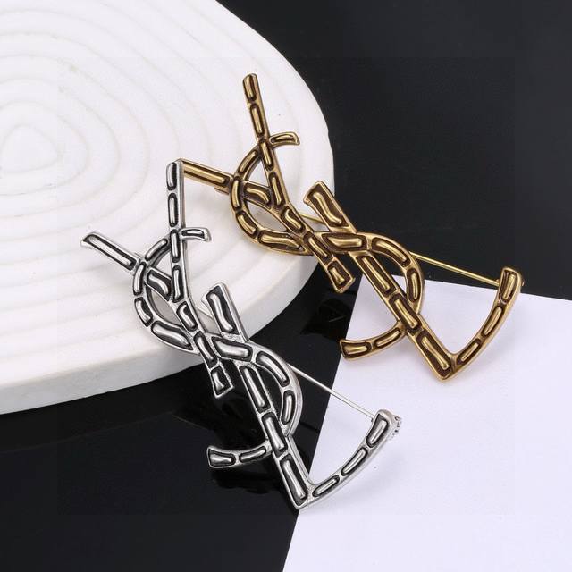 Original brass Yves Saint Laurent brooch. Founded in 1961, Yves Saint Laurent's