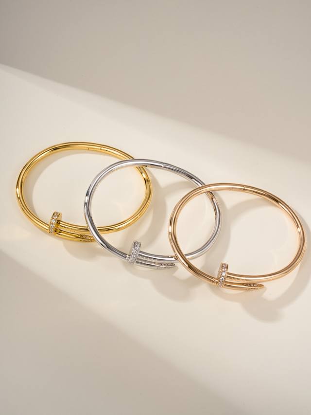 Cartier's classic nail bracelet, a thicker version with diamonds at both ends, n